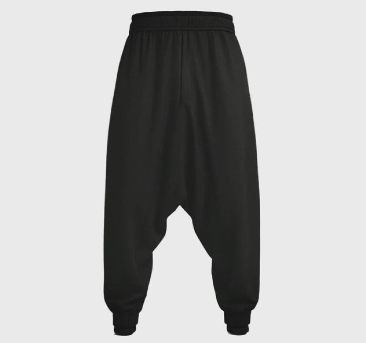 Black harem pants on a gray background