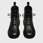Pair of black leather boots on a gray background