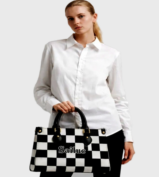 Woman holding a black and white checkered bag with Sailuc branding against a gray background