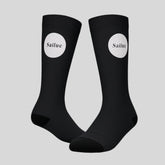 Black Sailuc luxury fashion socks with white logo on a gray background