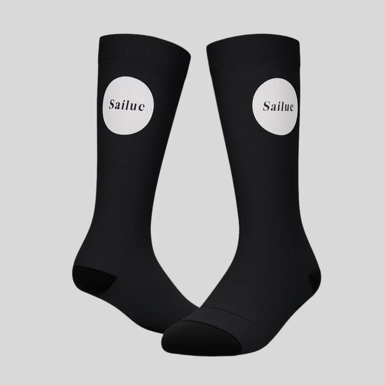 Black Sailuc luxury fashion socks with white logo on a gray background