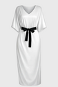 White dress with a black belt on a gray background