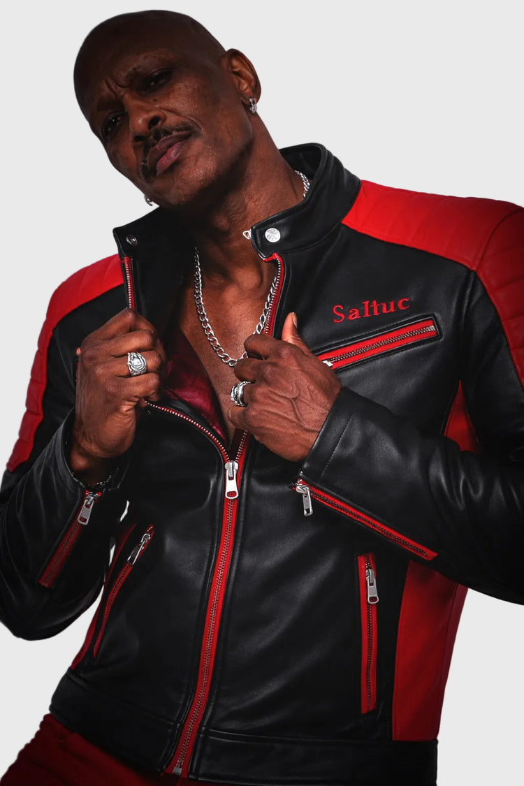 Person wearing a black and red jacket with &