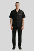 Man modeling Sailuc luxury black short-sleeve shirt and trousers, modern fashion style