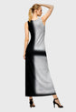 Woman wearing a black and gray dress on a gray background