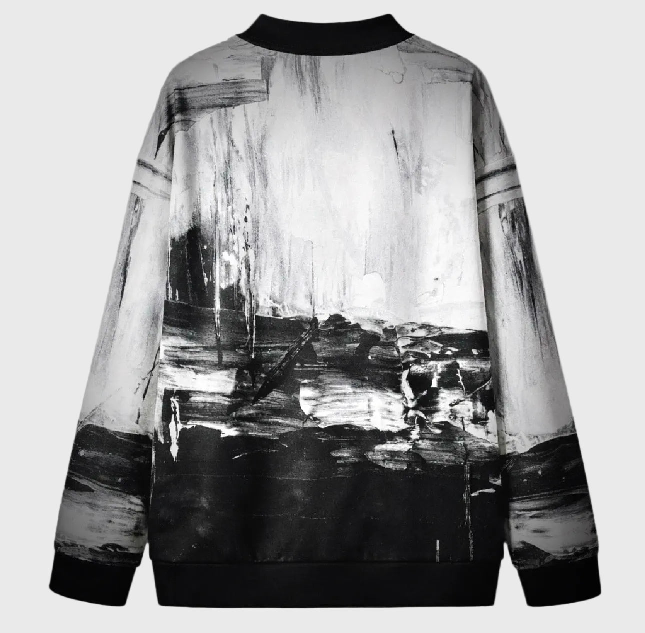 Black and white abstract patterned shirt on a gray background