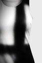 Close-up of a white tank top with a blurred background