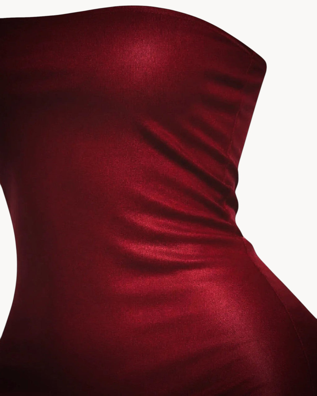 Red strapless dress on a gray background