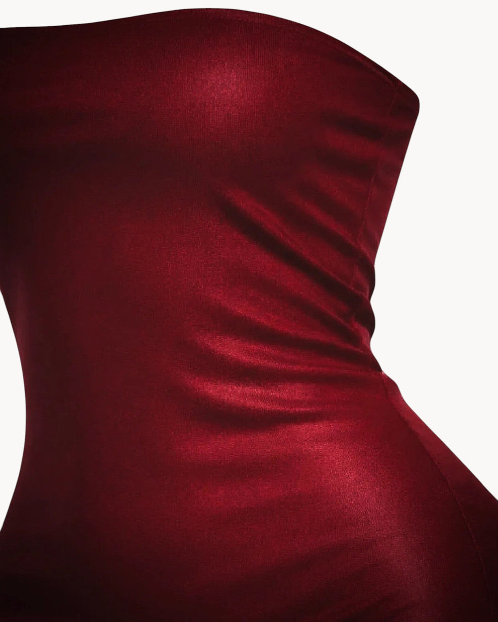 Red strapless dress on a gray background