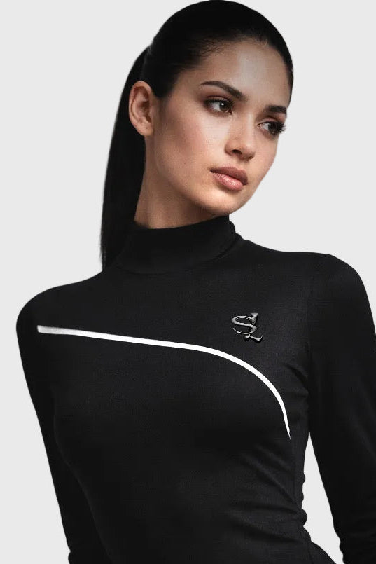 Woman wearing a black bodysuit with a logo on a gray background