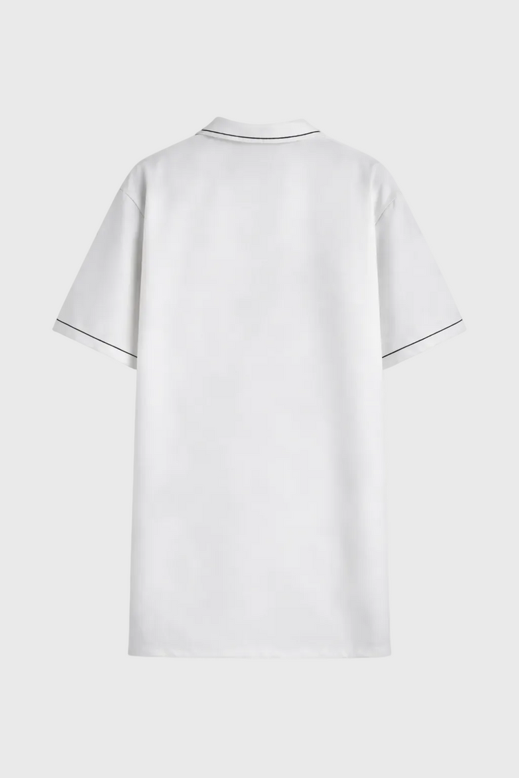 White shirt with black trim on a gray background