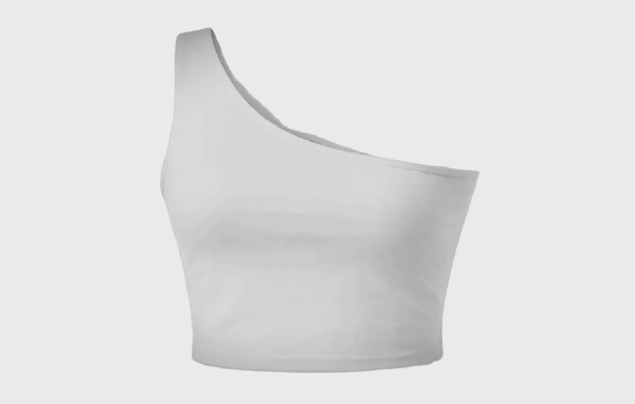 White one-shoulder top on a gray background