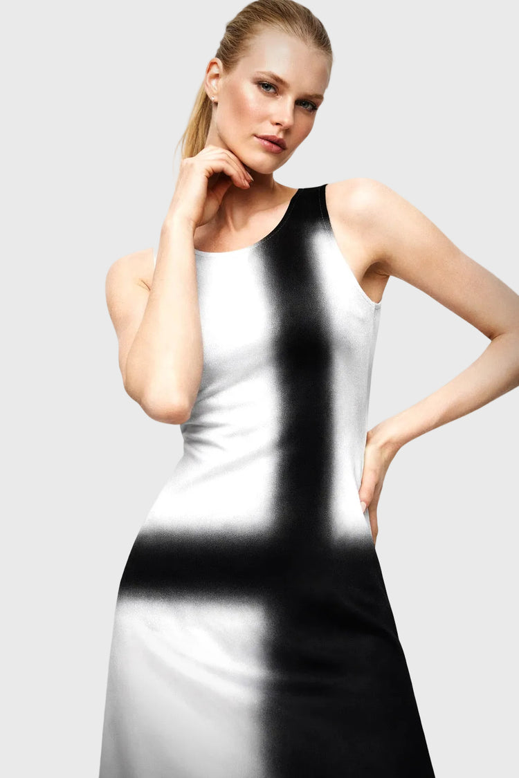 Woman wearing a white dress with a black silhouette effect on a gray background