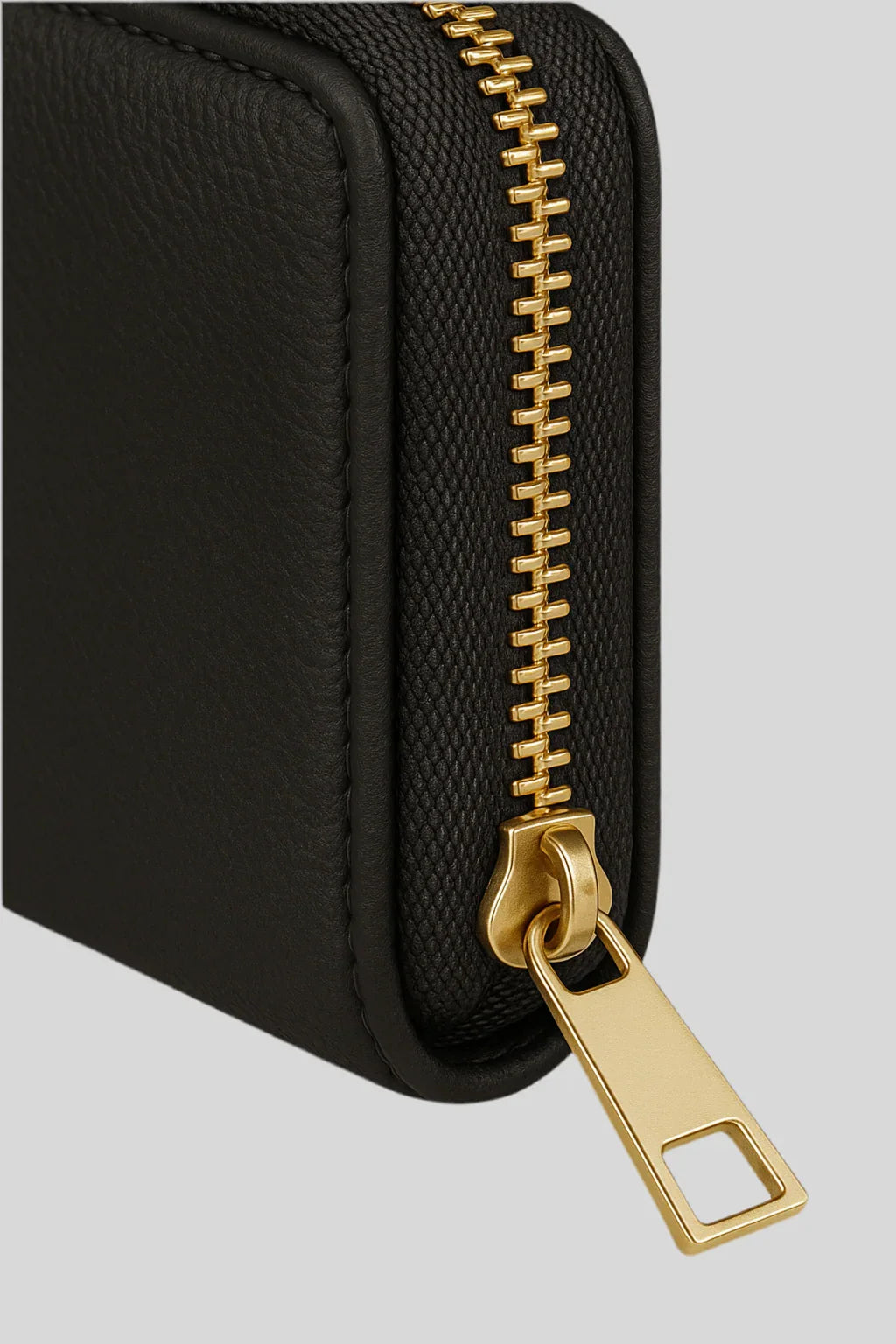 Close-up of luxury black leather wallet with gold zipper, Sailuc accessories