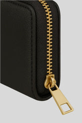 Close-up of luxury black leather wallet with gold zipper, Sailuc accessories