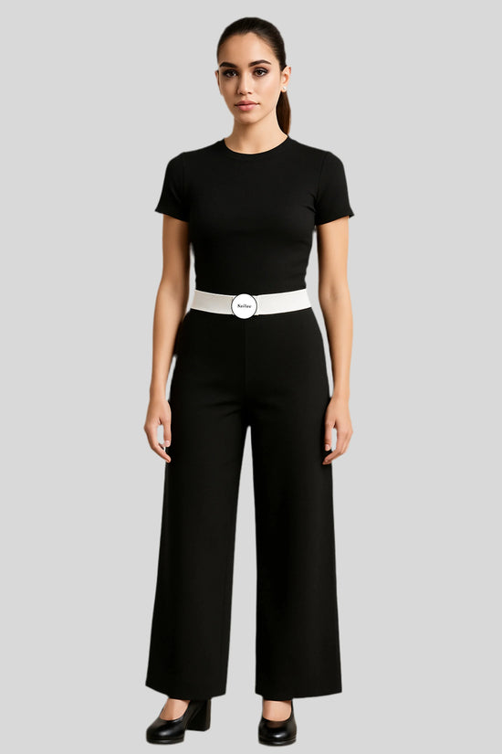 Woman in black jumpsuit with white Sailuc belt, luxury fashion, gray background