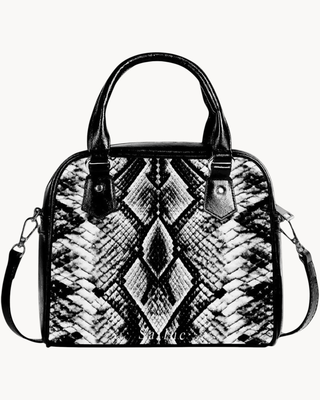 Black and white patterned handbag on a gray background