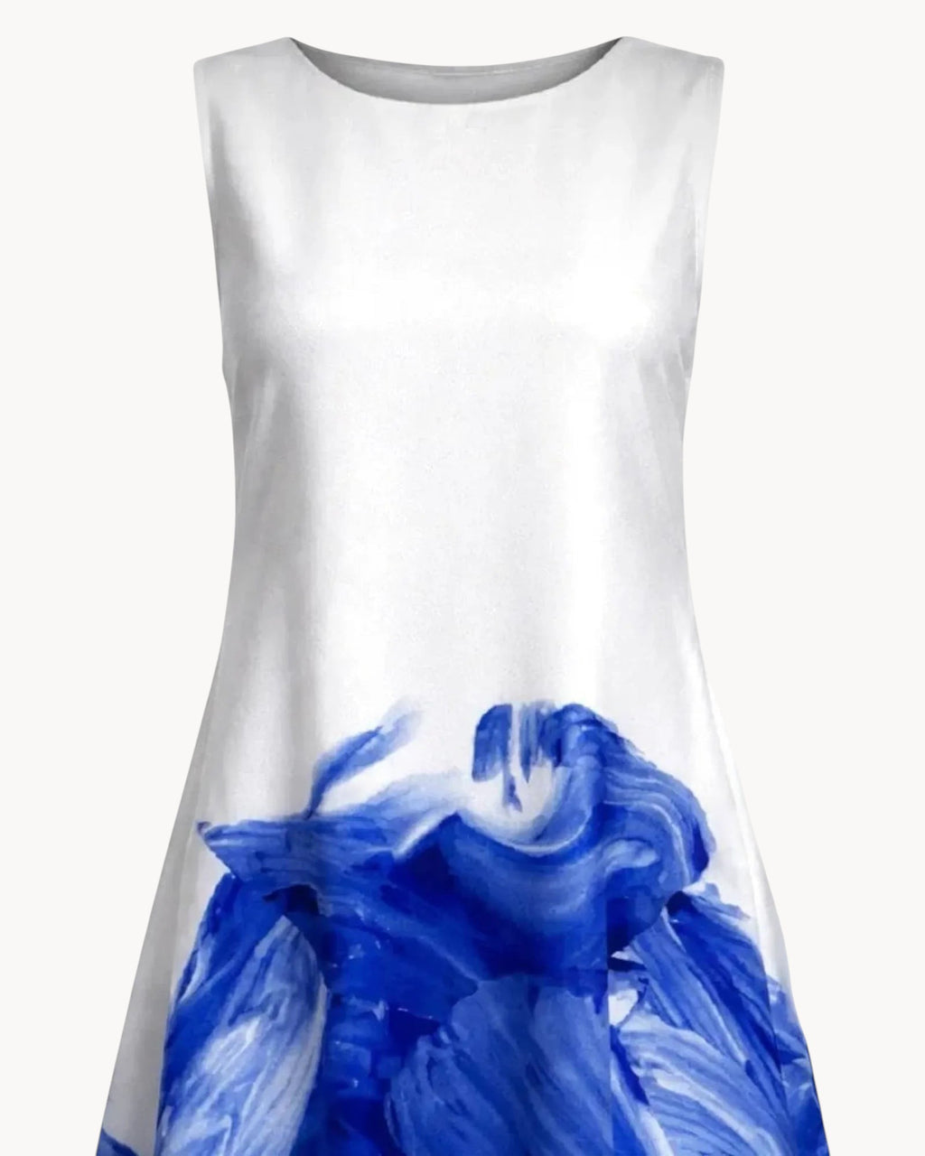 White dress with blue wave design on a gray background