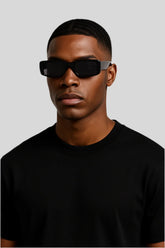 Stylish man wearing black rectangular sunglasses and black t-shirt, Sailuc luxury fashion