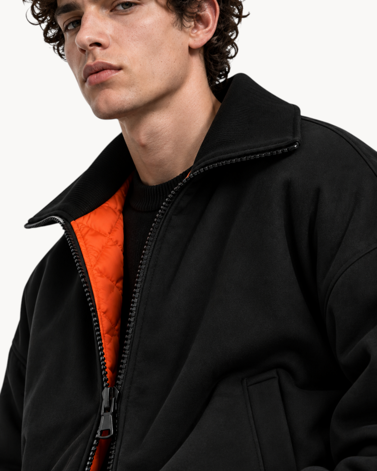 Sailuc Noma black Hacci fleece jacket with a lapel collar, zip closure, and a contrasting orange quilted lining.