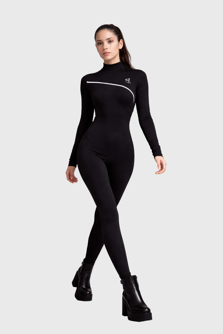 Person wearing a black bodysuit with white accents on a gray background