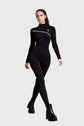 Person wearing a black bodysuit with white accents on a gray background