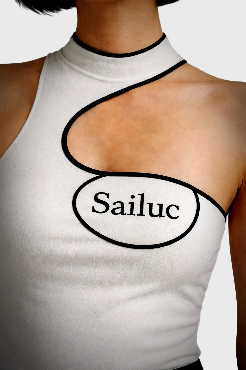 White sleeveless top with &