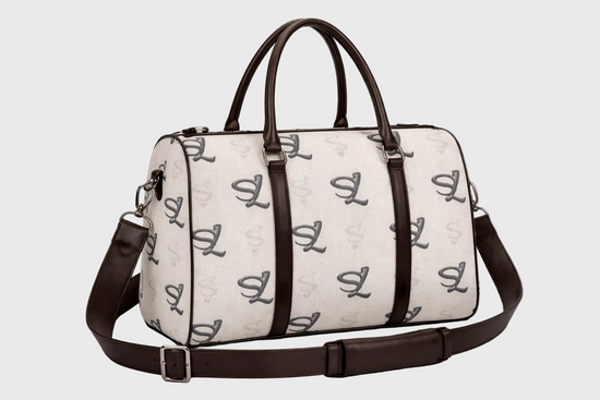 gray travel bag with brown straps on a white background