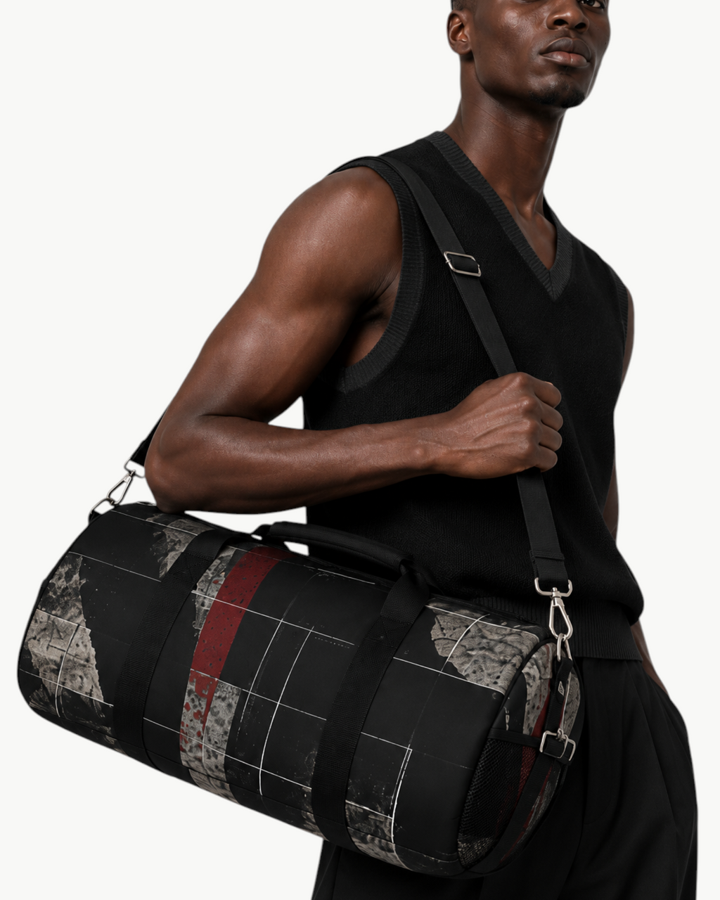 A model carrying a Sailuc Obscura duffle bag with dark abstract art on Oxford canvas and brushed nickel hardware.