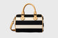Black and beige striped handbag with accents on a gray background