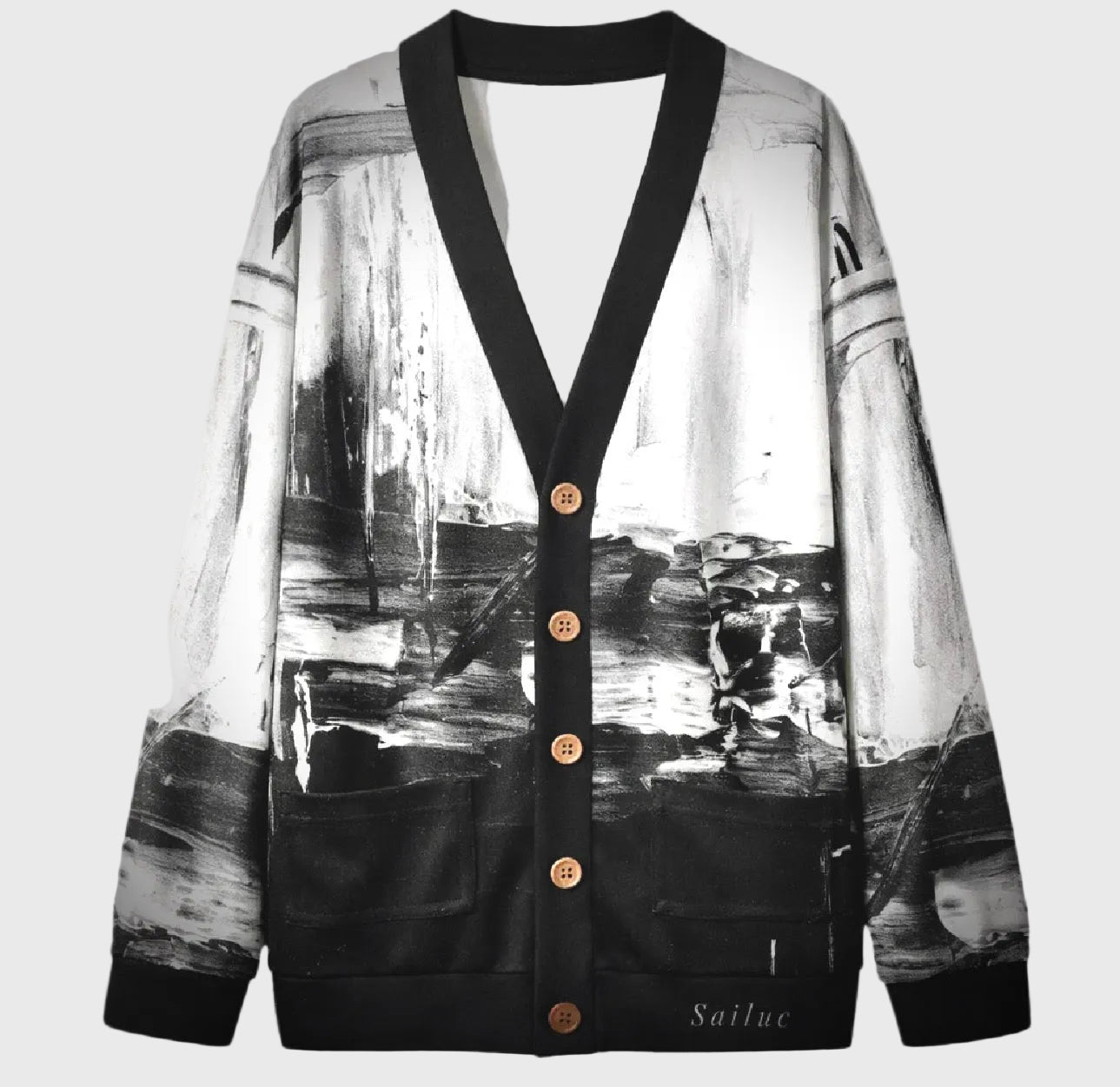 Cardigan with black and white abstract design on a gray background