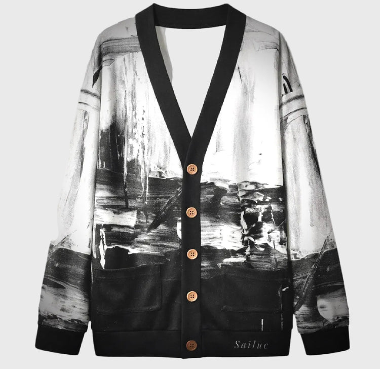 Cardigan with black and white abstract design on a gray background
