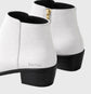 White ankle boots with black soles on a light gray background, featuring the brand Sailuc