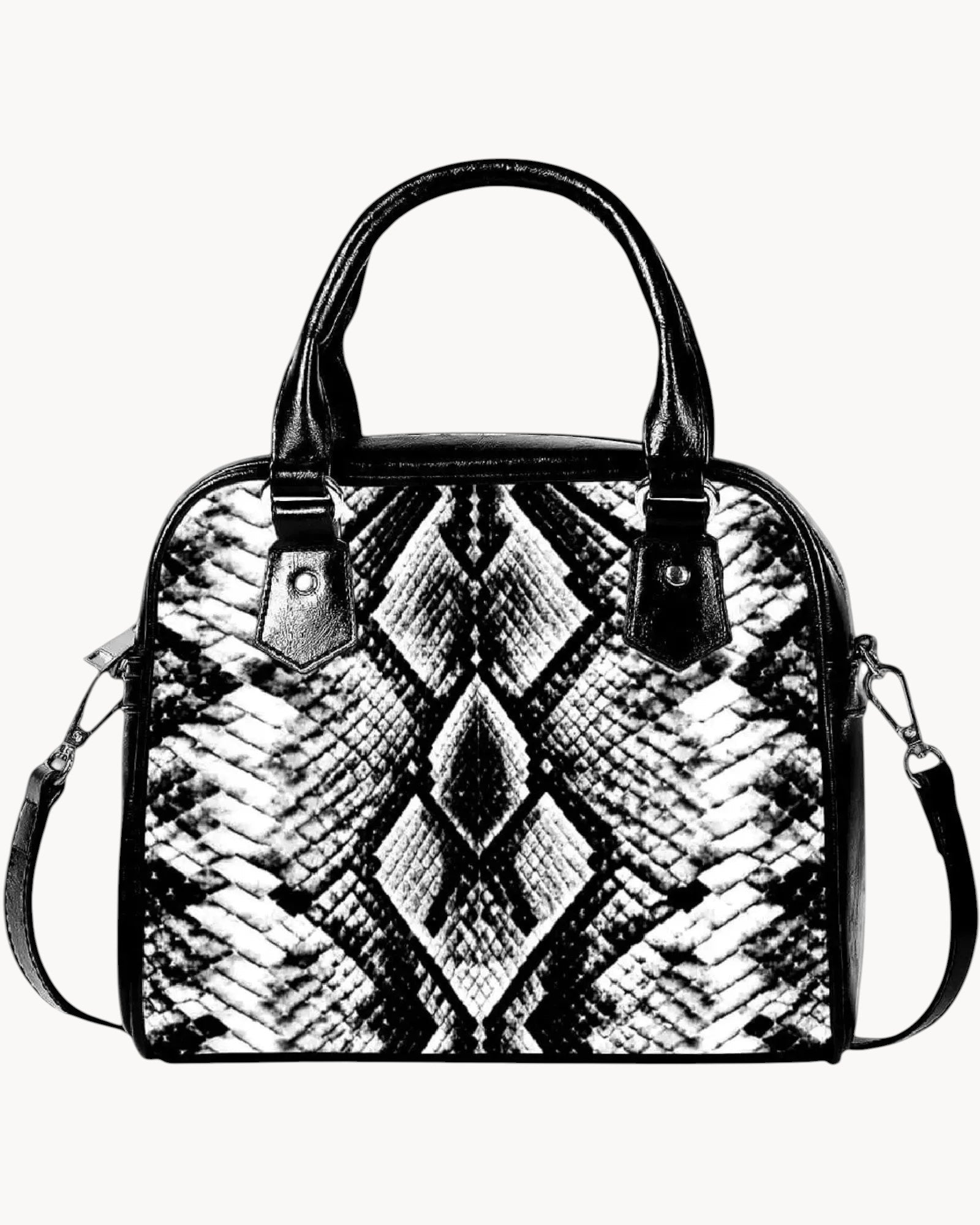 Black and white patterned handbag on a gray background