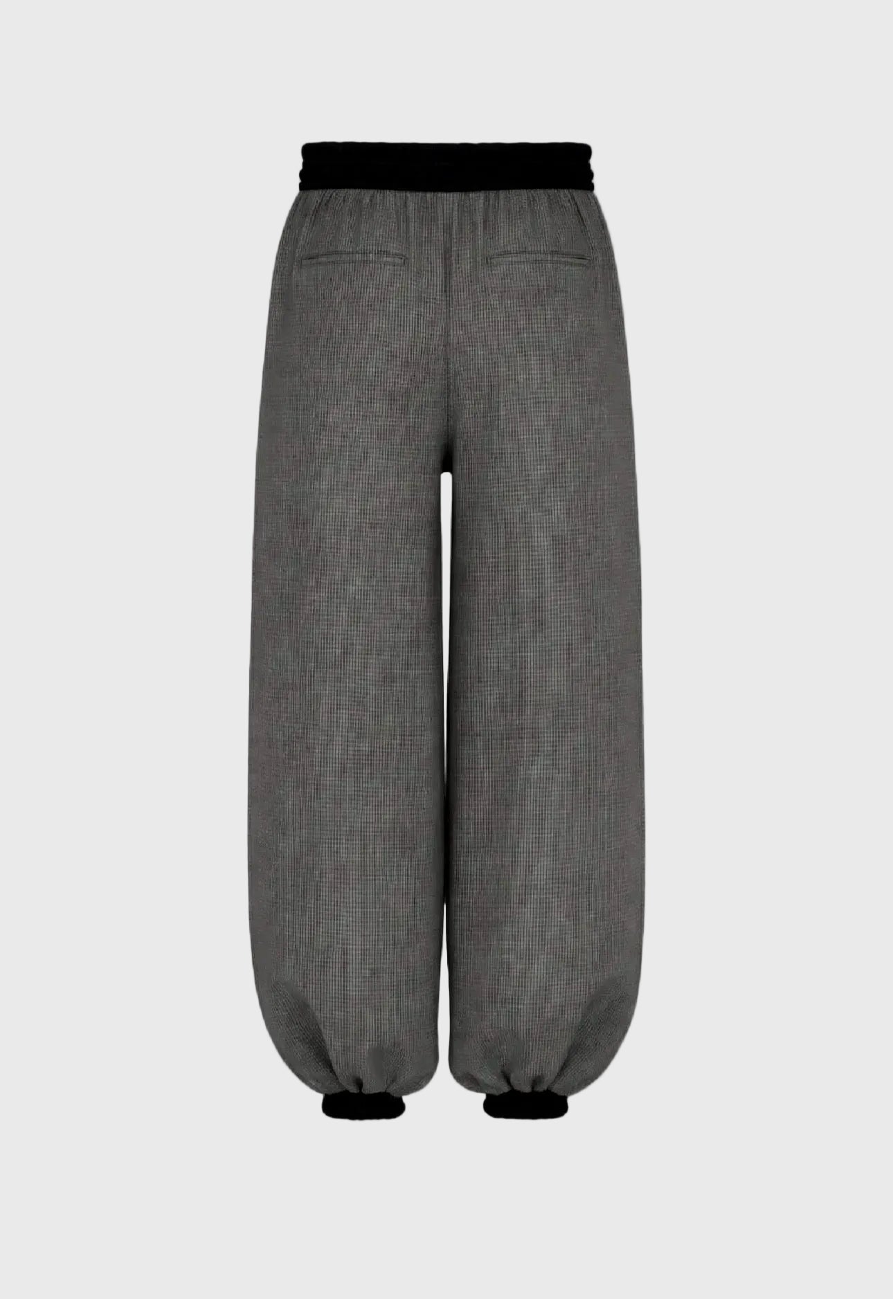 Gray pants with black waistband on a gray background