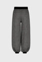 Gray pants with black waistband on a gray background