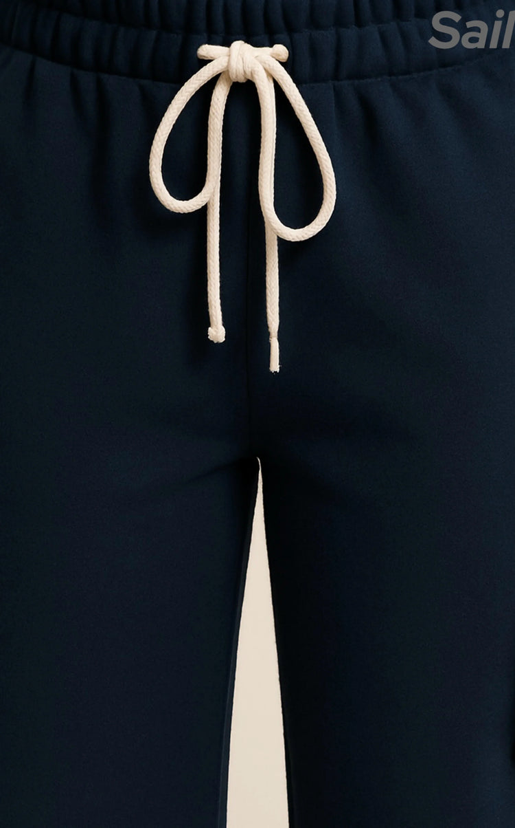 Navy blue Sailuc joggers with white drawstring, luxury men&