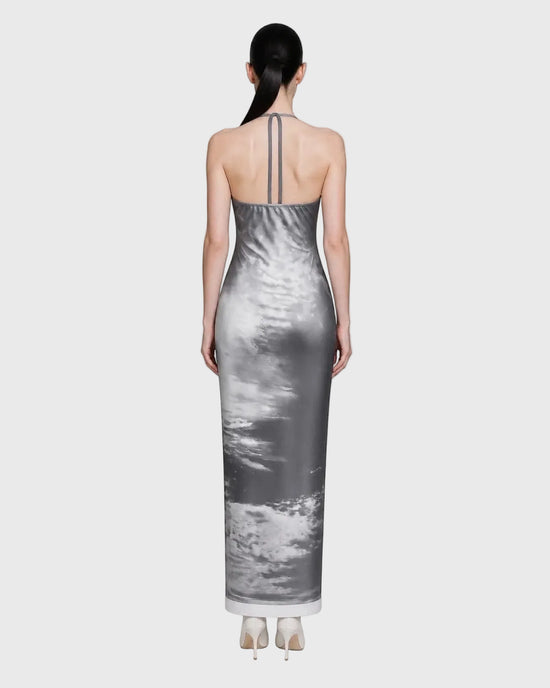 Woman wearing a gray sky dress with a white background