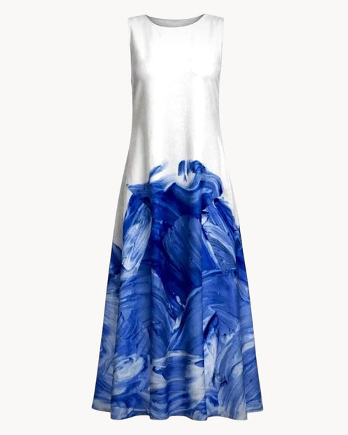 White dress with blue abstract pattern on a gray background