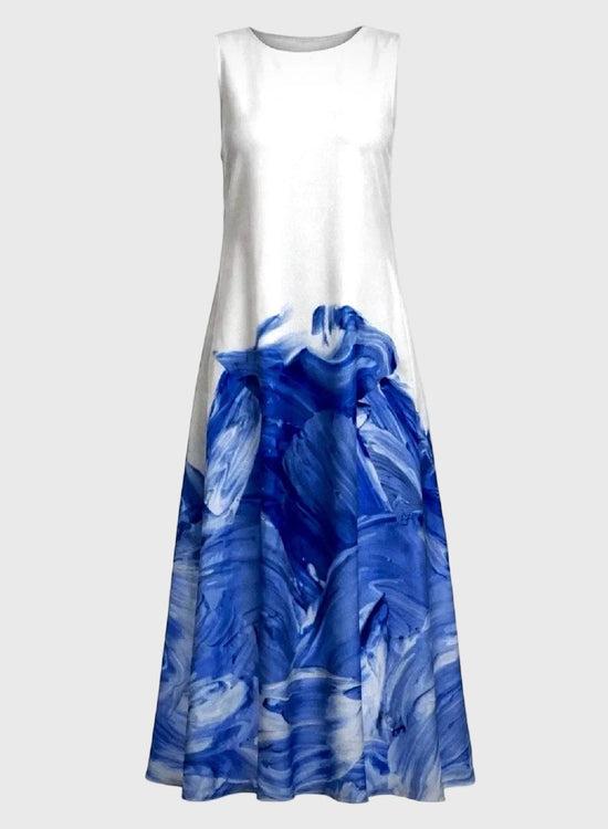 White dress with blue abstract pattern on a gray background