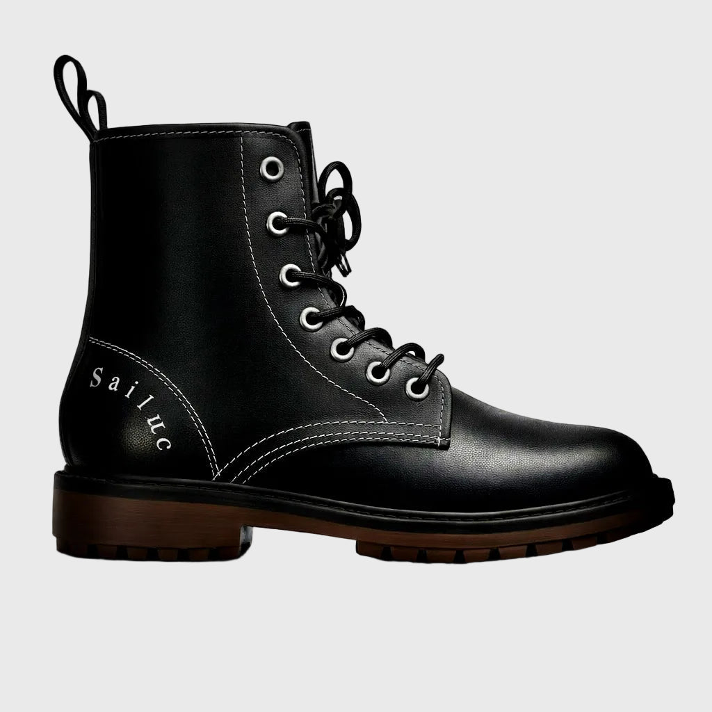 Black leather boot with visible brand name on a gray background