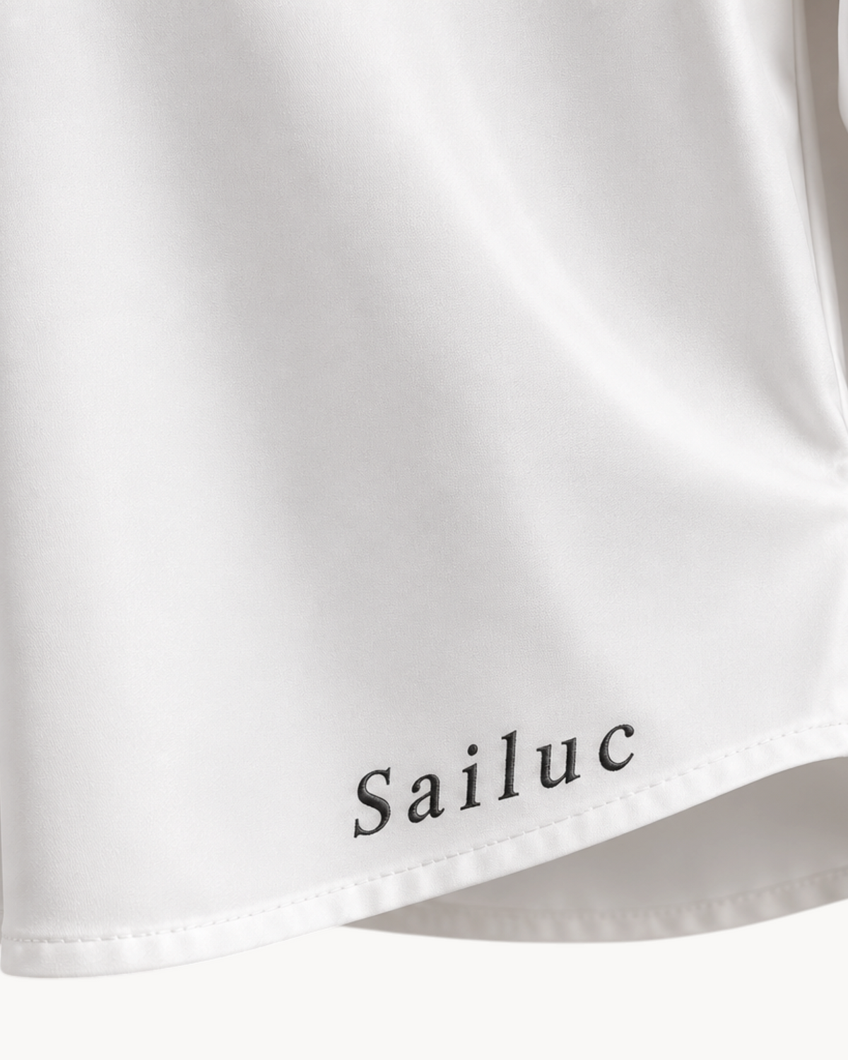 Sailuc white longline shirt featuring a classic collar, buttoned cuffs, and soft lightweight fabric