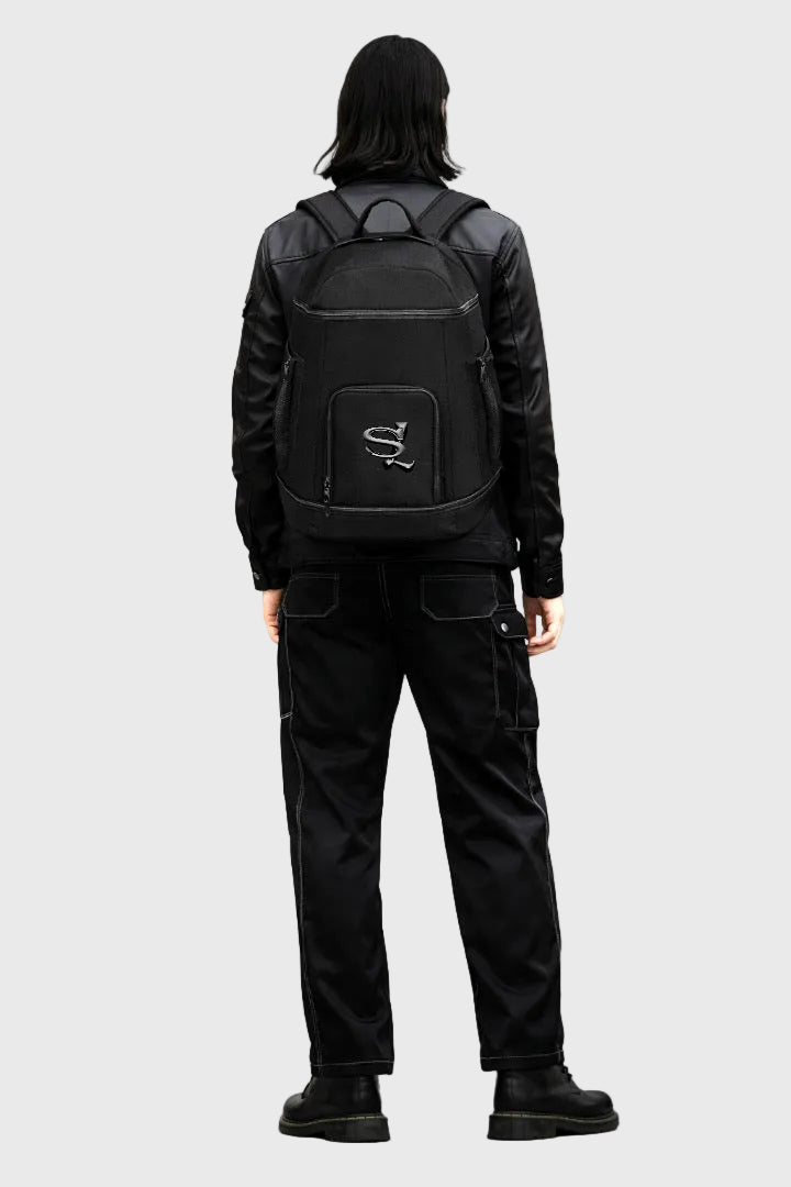 Person wearing a black backpack with a Sailuc  brand logo on a gray background