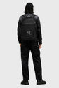 Person wearing a black backpack with a Sailuc  brand logo on a gray background
