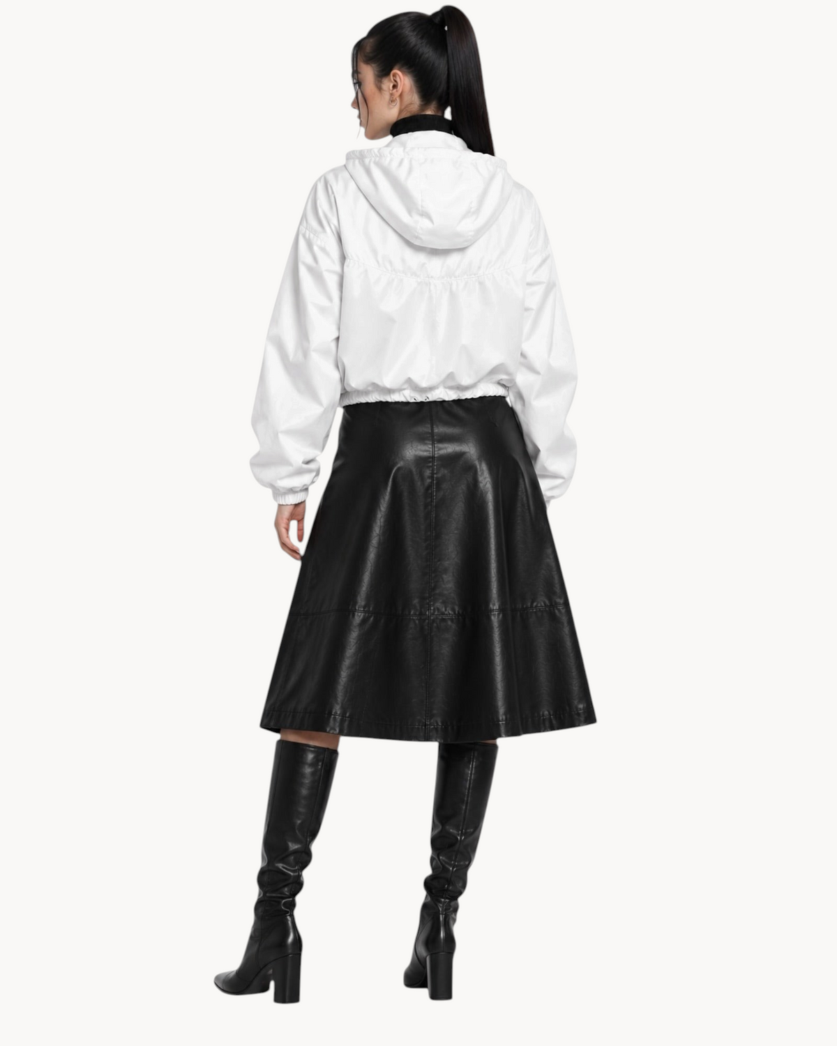 Sailuc white cropped windbreaker with hood and drawcord waist worn by a model from the back view