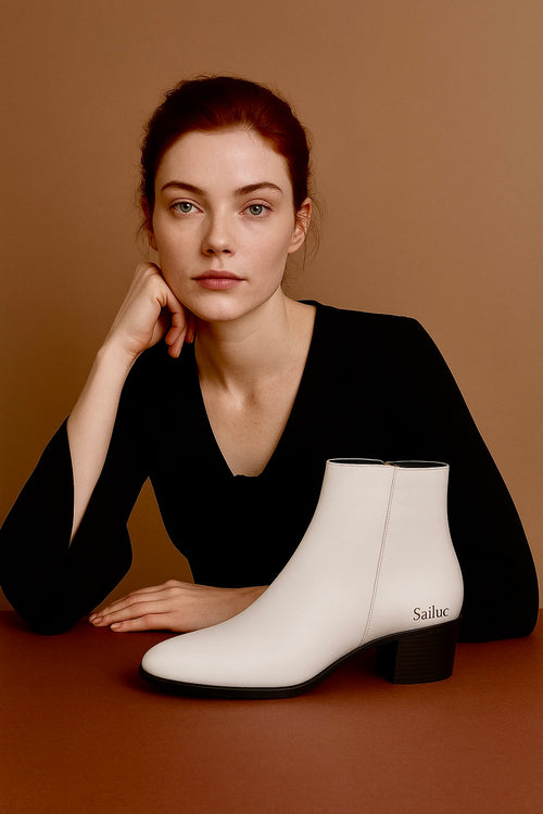 Woman with white ankle boots on a brown background