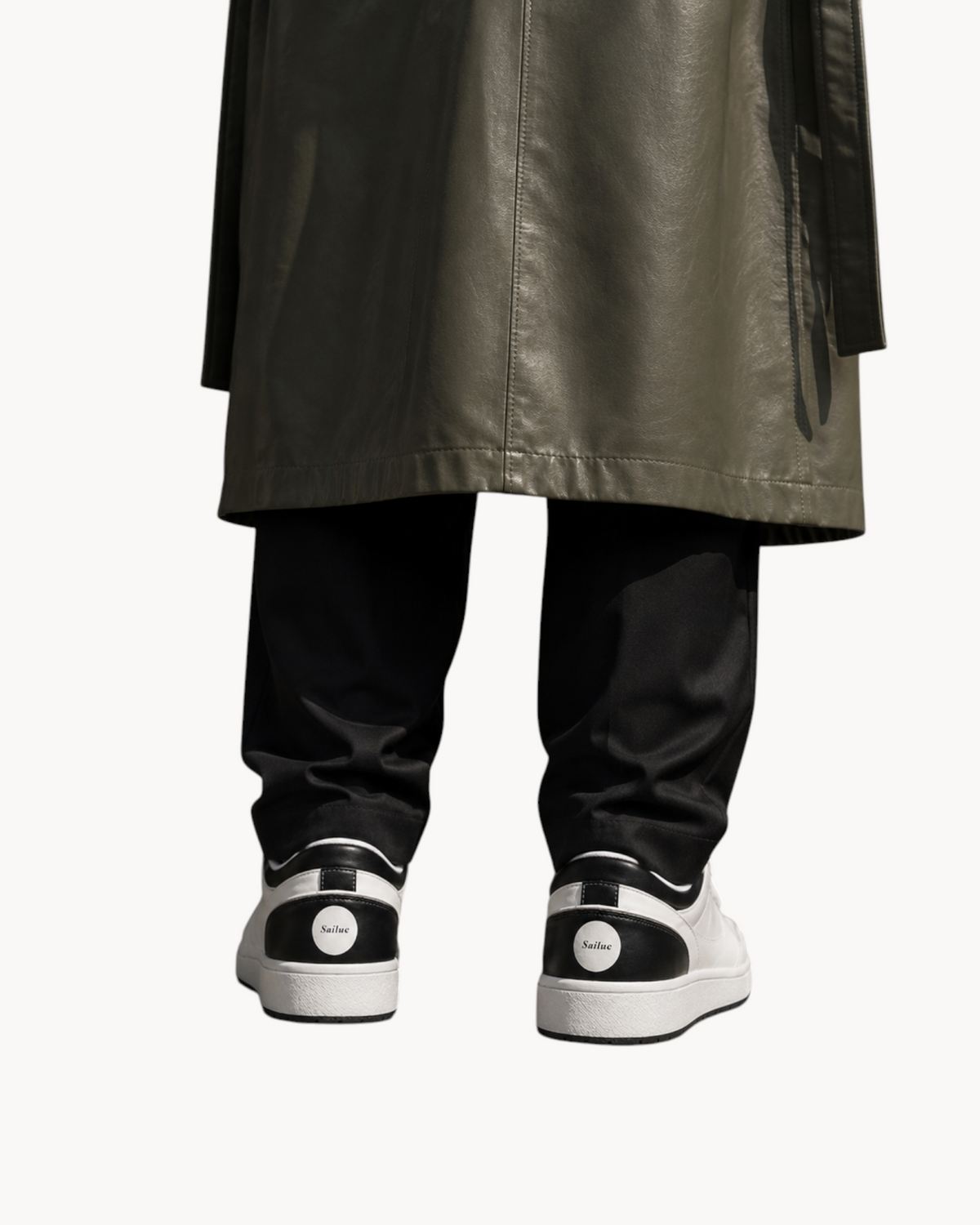 Sailuc Low Form sneakers in white and black technical PU with a minimal silhouette and branded heel detail.
