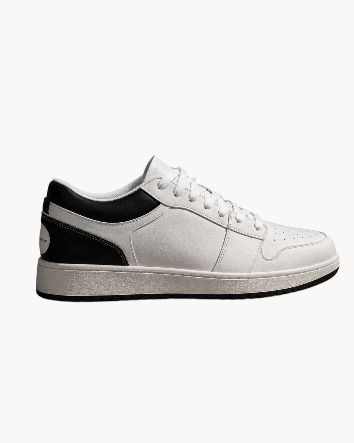 Side view of a Sailuc Linea white sneaker with black heel panels, white laces and a black outsole.