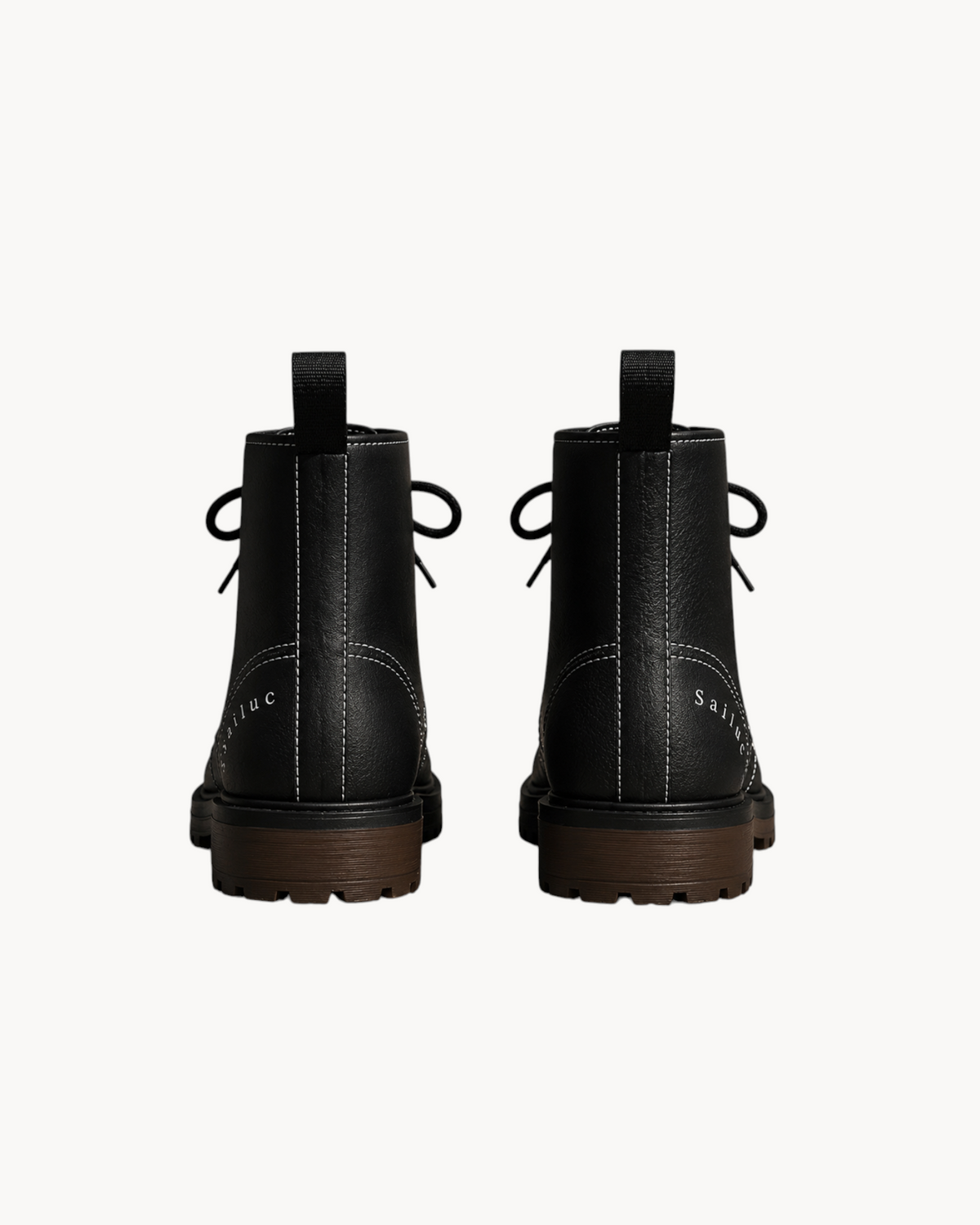 Rear view of Sailuc Martin Rugged Style black combat boots featuring white contrast stitching and brown lug soles.