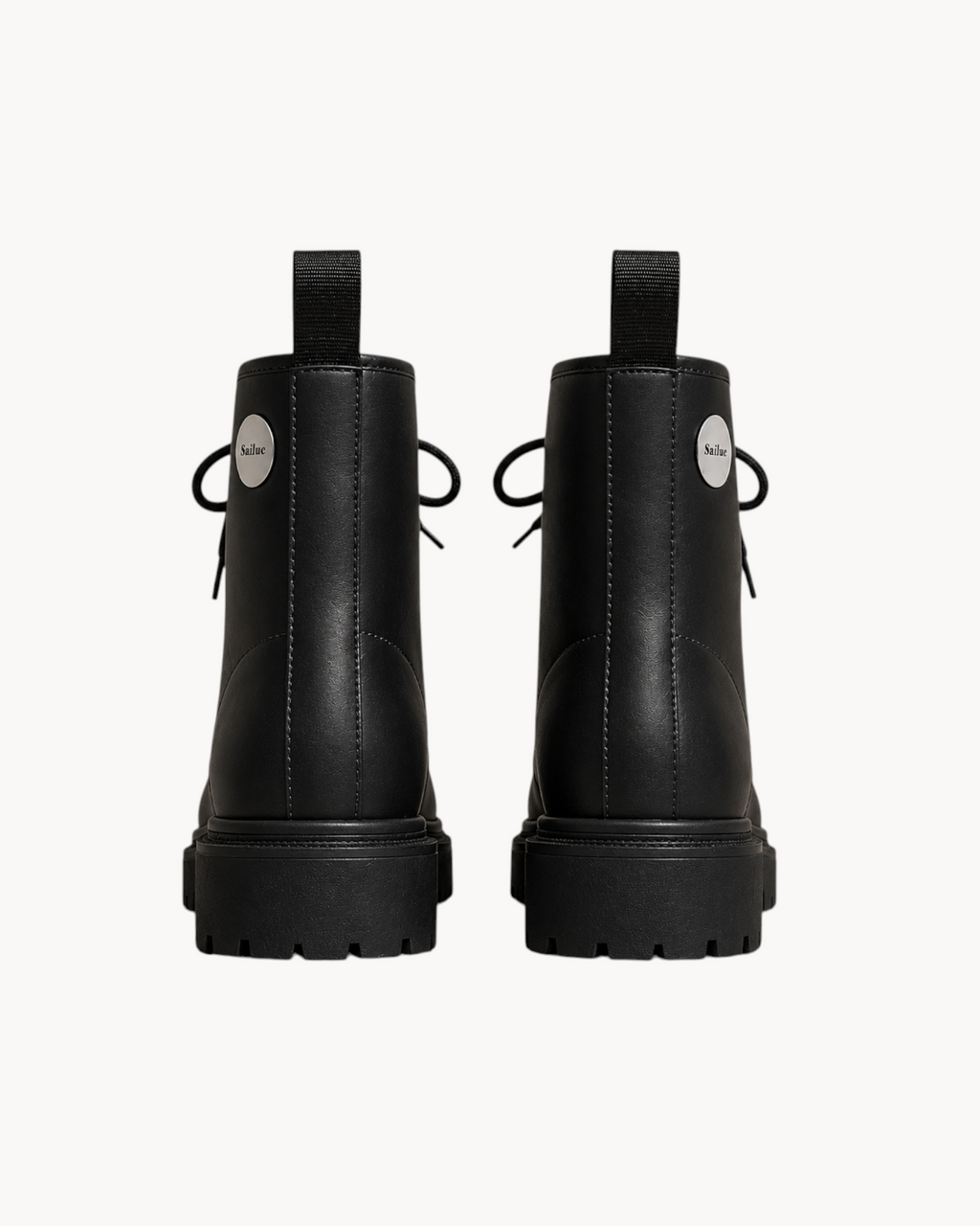 Sailuc Terrain Boots in black technical PU with a structured ankle-height silhouette and minimal seam detailing.